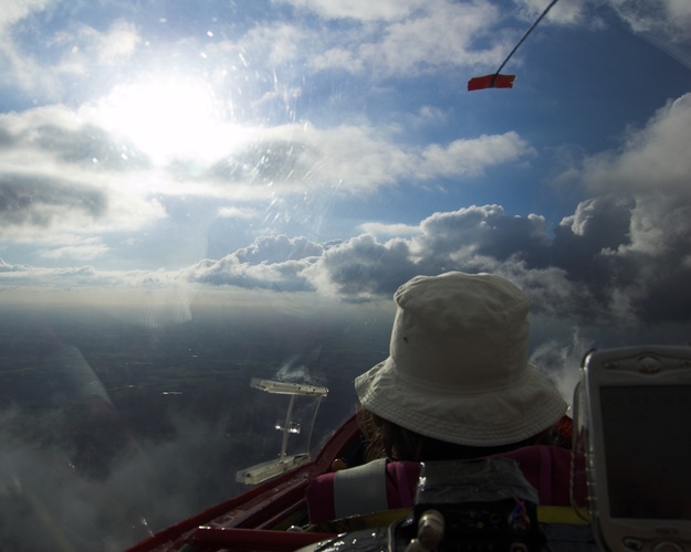 Flying out the side of a cloud