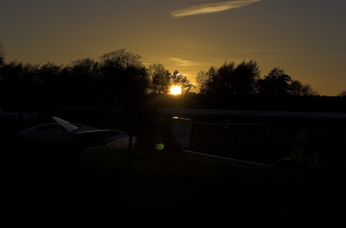 Parked gliders at sunset