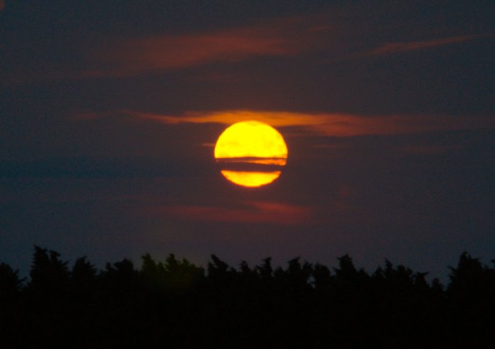 Moon behind clouds