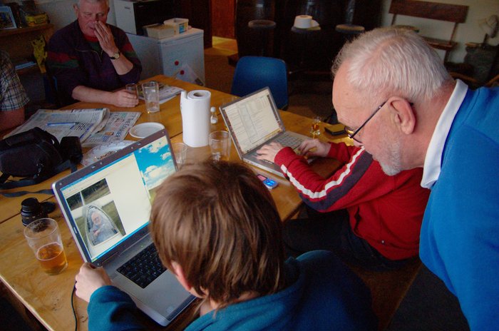 Ian Trotter inspects a photo of himself