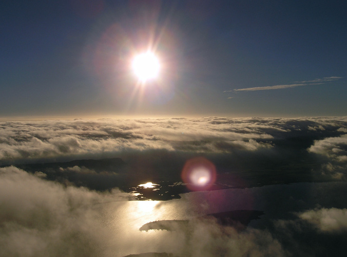 Above cloud looking down on a sunlit Loch Leven