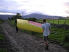 Martin and Andy carrying Snoopy's wing out of the field